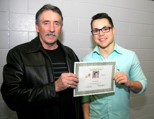 M.E. Rodgers presenting Ryan Thomas with the Bill and Molly Riome scholarship